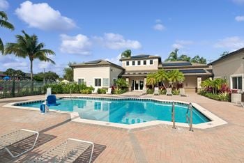 Swimming pool and deck with lounge chairs